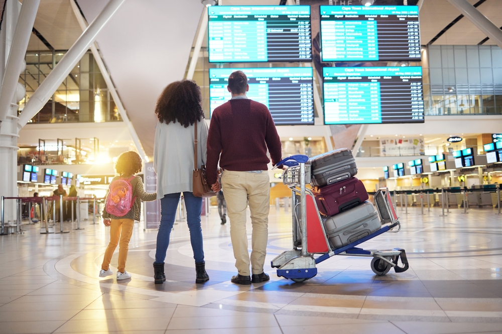Family,,Holding,Hands,And,Travel,Waiting,At,Airport,Checking,Flight Taking the final step in a citizenship-by-investment process