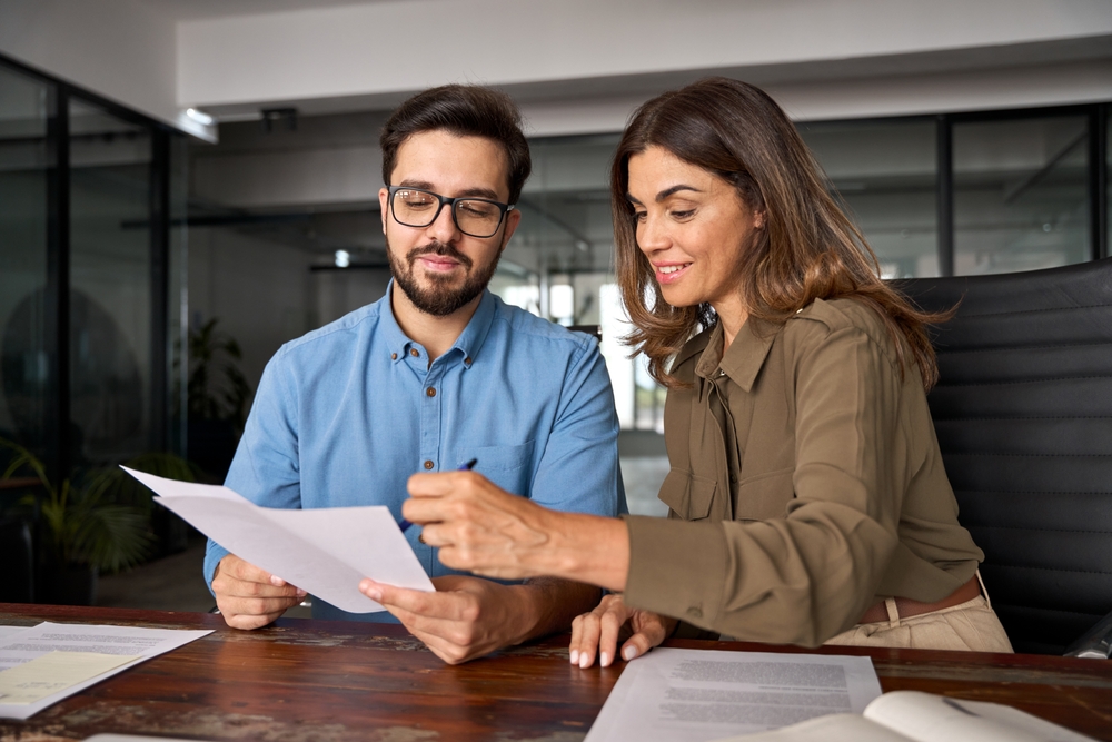 A consultant discussing the Malta residency application process