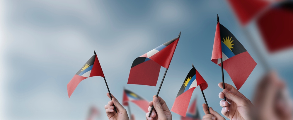 People holding the flag of Antigua and Barbuda