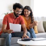 A couple checks the cost of living in the Caribbean