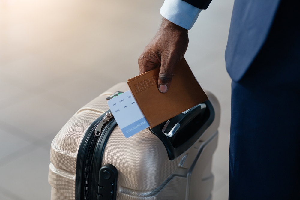 A man with passport and luggage ready for travel 